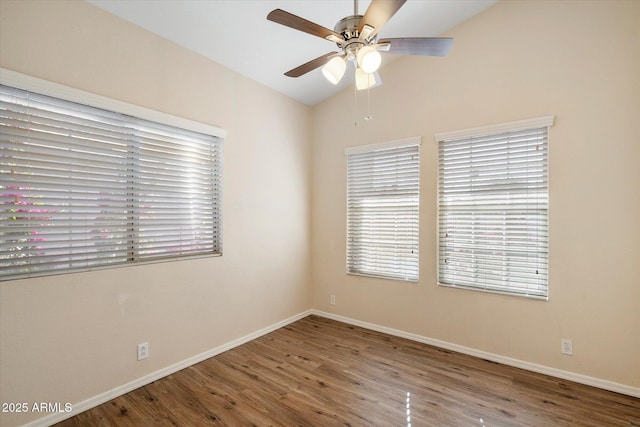 empty room with ceiling fan, wood-type flooring, and lofted ceiling