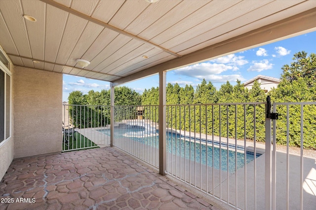 view of swimming pool featuring a patio area