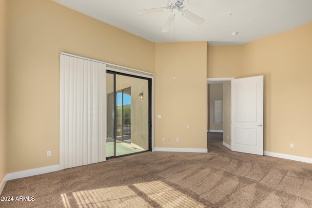 spare room with carpet flooring and ceiling fan