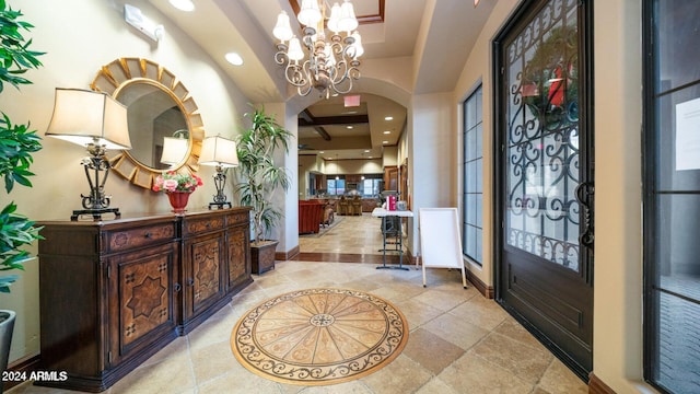 entryway featuring an inviting chandelier