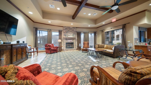 living room with a stone fireplace, light tile patterned floors, coffered ceiling, ceiling fan, and beam ceiling