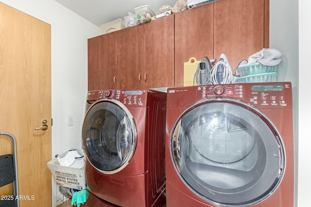 laundry area featuring cabinet space and washing machine and dryer