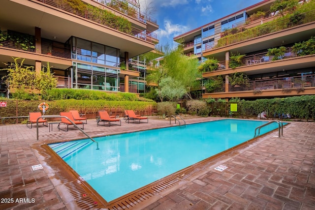 community pool with a patio