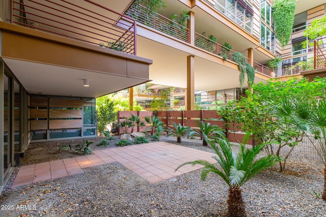 view of patio featuring fence