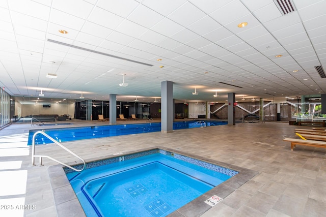view of pool with an in-ground hot tub and a patio area