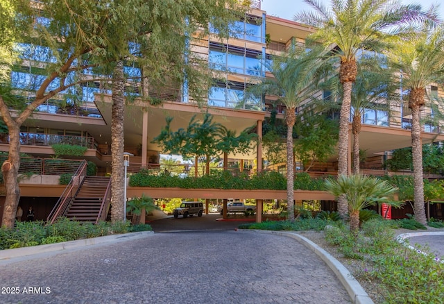 view of property featuring stairway