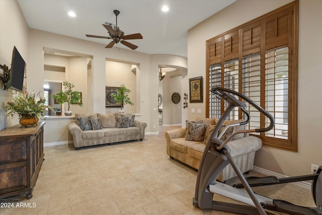 exercise room with ceiling fan and a wealth of natural light