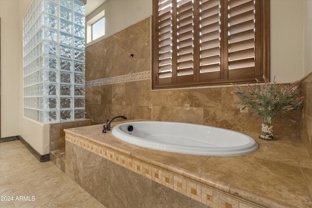 bathroom featuring tiled bath