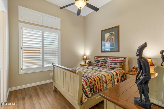 bedroom featuring light hardwood / wood-style floors and ceiling fan