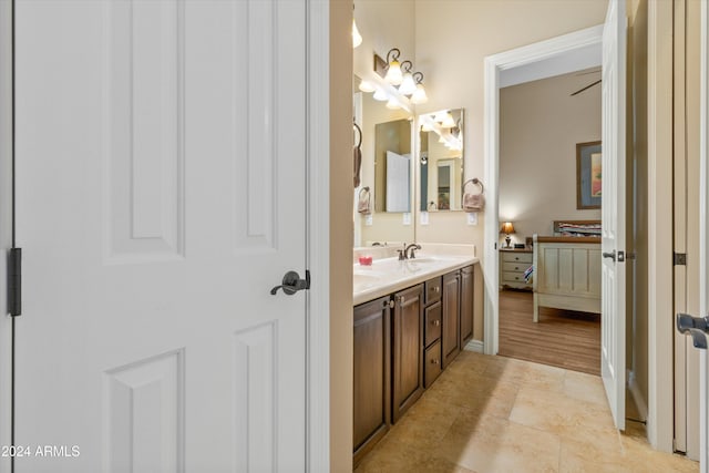 bathroom with tile patterned flooring and vanity