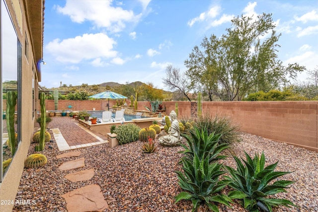 view of yard with a mountain view and a patio area