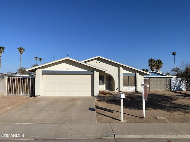 ranch-style house featuring a garage