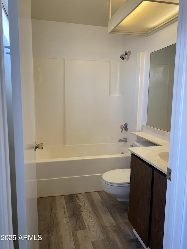 full bathroom with vanity, toilet, hardwood / wood-style floors, and shower / bathing tub combination