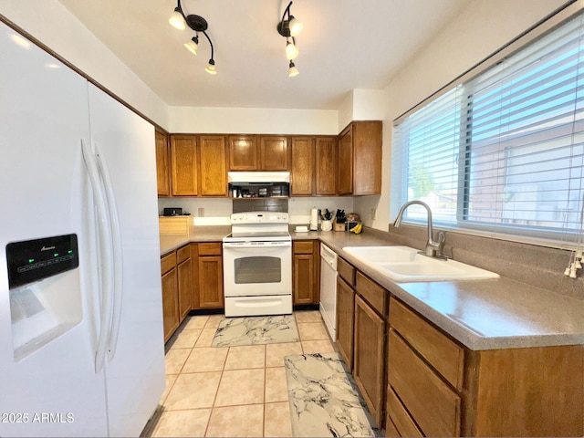 kitchen with sink and white appliances