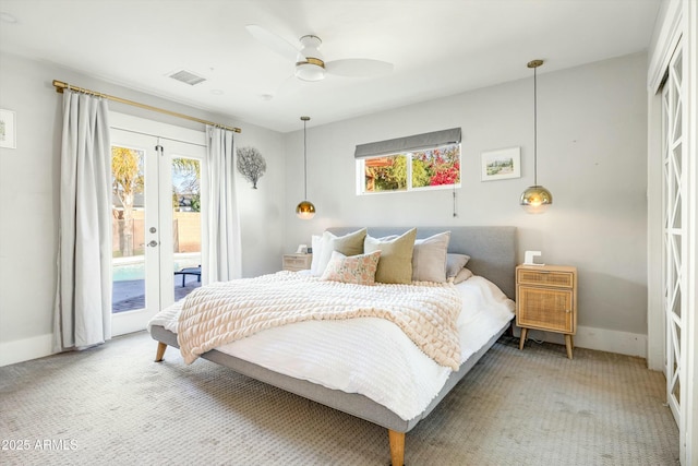 bedroom featuring access to outside, french doors, multiple windows, and visible vents