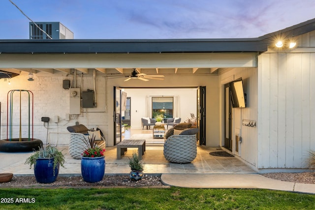 view of patio / terrace featuring a ceiling fan and an outdoor living space