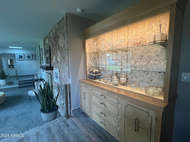 bar with dark wood-type flooring