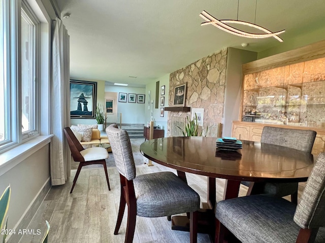 dining area with wood-type flooring