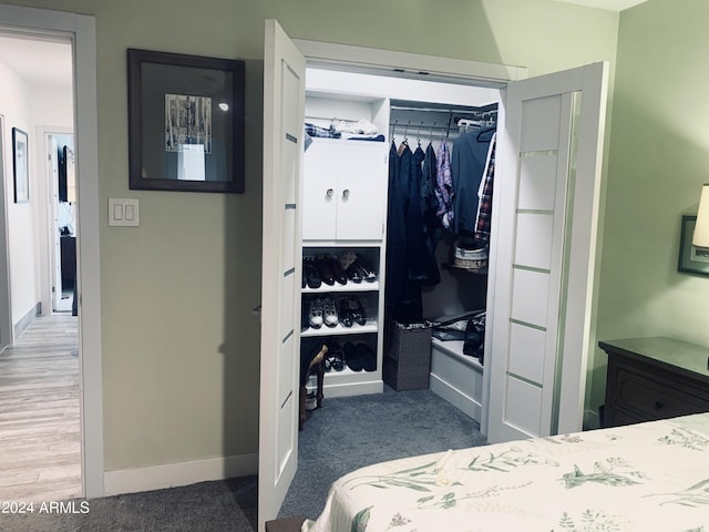 carpeted bedroom featuring a closet