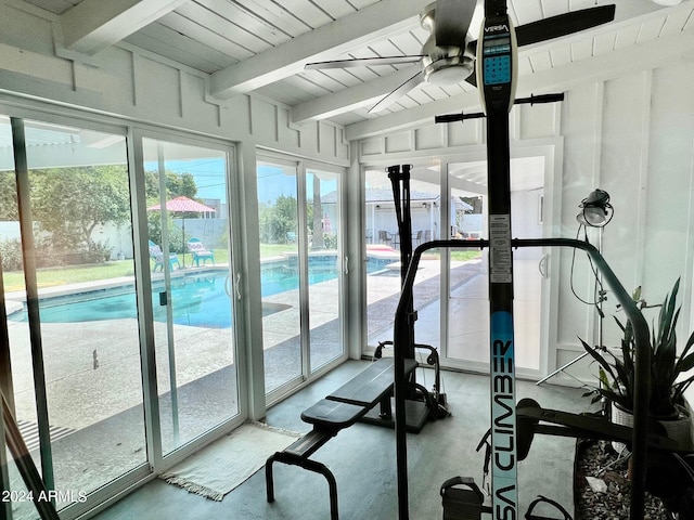 workout area with a healthy amount of sunlight, wood ceiling, and ceiling fan