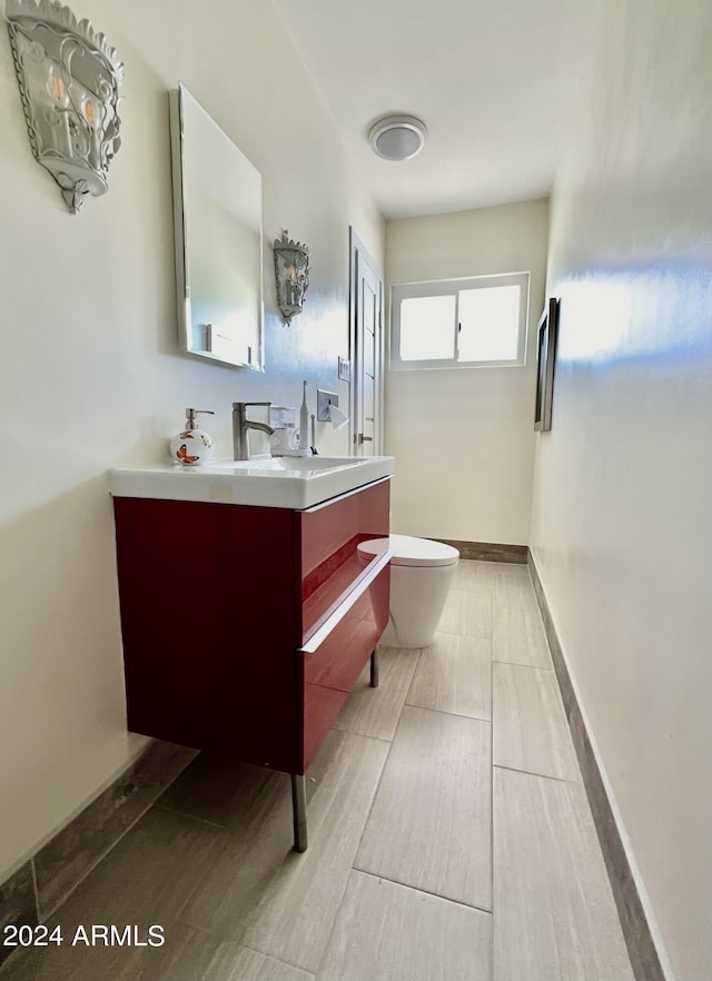 bathroom with vanity and toilet