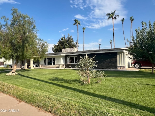 ranch-style house with a front lawn