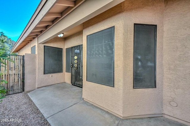 doorway to property with a patio