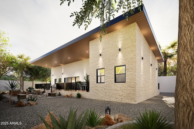 back of property with a patio area, fence, and stucco siding