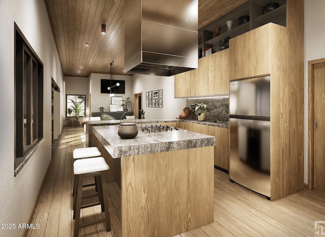 kitchen with a kitchen island with sink, exhaust hood, appliances with stainless steel finishes, open shelves, and modern cabinets