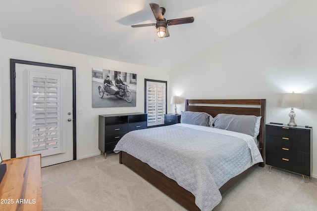 bedroom with lofted ceiling, light carpet, and ceiling fan