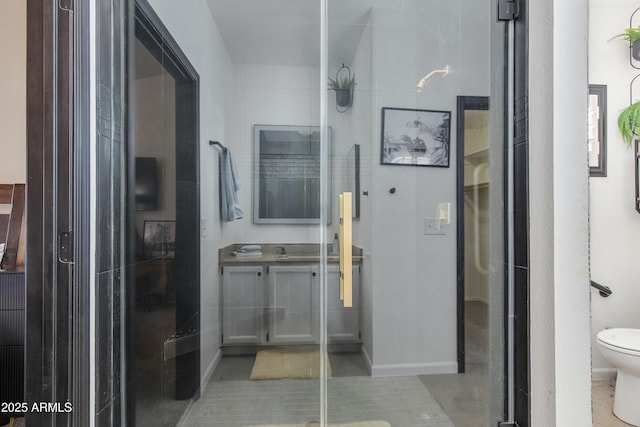 bathroom featuring vanity, toilet, and tile patterned floors