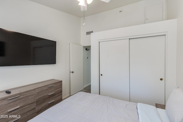 bedroom with a closet and visible vents