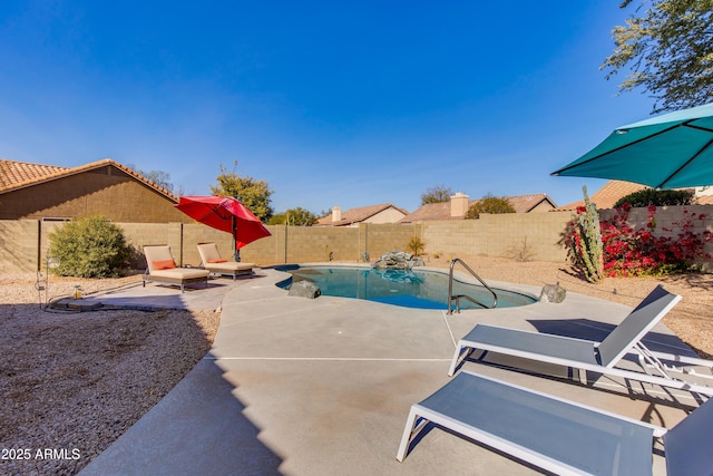 view of swimming pool featuring a fenced in pool, a fenced backyard, and a patio