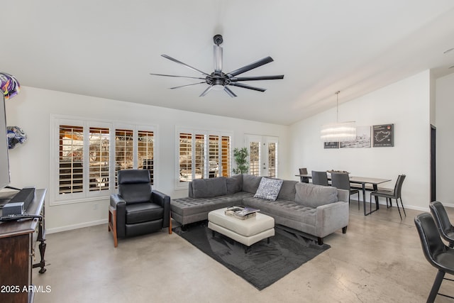 living room featuring baseboards, a ceiling fan, vaulted ceiling, french doors, and concrete floors