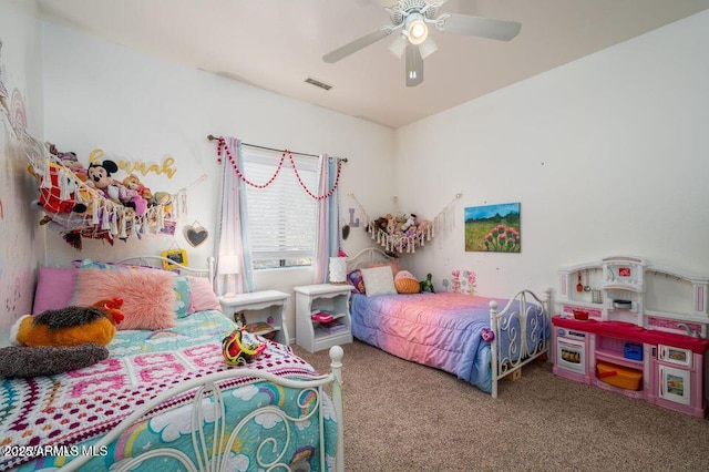 carpeted bedroom with ceiling fan and visible vents