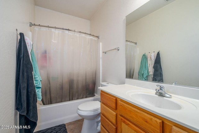 full bathroom featuring toilet, shower / bath combo, vanity, and tile patterned floors