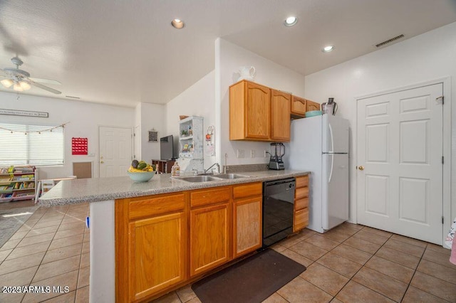 kitchen with freestanding refrigerator, dishwasher, a sink, and light tile patterned floors