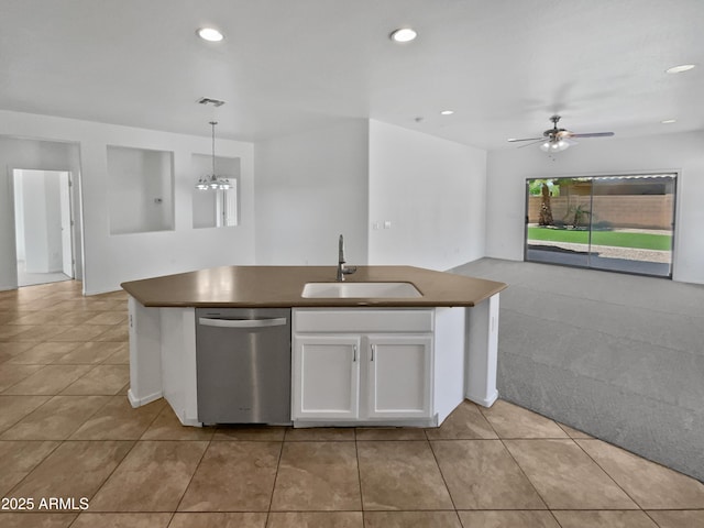 8616 S 57th Dr, Laveen, AZ 85339 - kitchen featuring a sink, open floor plan, stainless steel dishwasher, and dark countertops