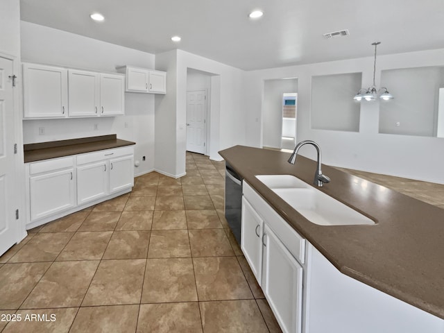 8616 S 57th Dr, Laveen, AZ 85339 - kitchen featuring stainless steel dishwasher, white cabinetry, visible vents, a sink, and dark countertops