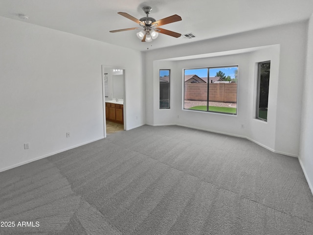 8616 S 57th Dr, Laveen, AZ 85339 - unfurnished room featuring visible vents, ceiling fan, carpet, and baseboards