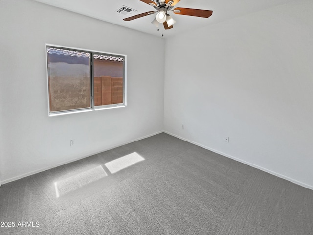 8616 S 57th Dr, Laveen, AZ 85339 - unfurnished room featuring baseboards, dark colored carpet, a ceiling fan, and visible vents