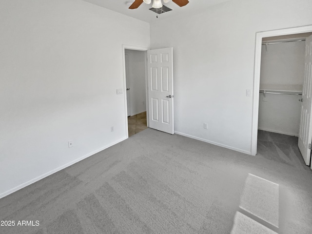 8616 S 57th Dr, Laveen, AZ 85339 - unfurnished bedroom with baseboards, a closet, a spacious closet, carpet floors, and ceiling fan