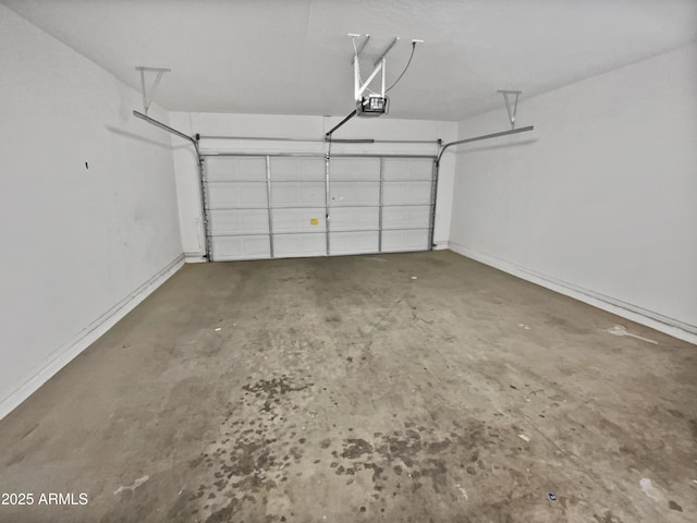 8616 S 57th Dr, Laveen, AZ 85339 - garage with baseboards and a garage door opener