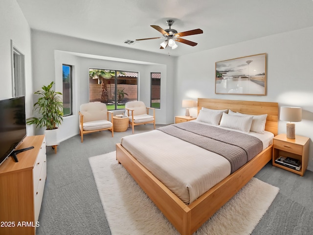 8616 S 57th Dr, Laveen, AZ 85339 - carpeted bedroom with visible vents and a ceiling fan