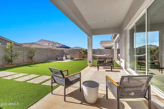 view of patio featuring an outdoor living space with a fire pit