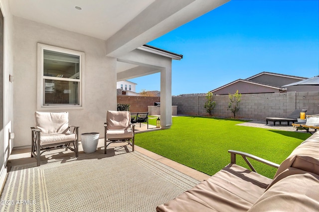 view of patio with an outdoor living space with a fire pit