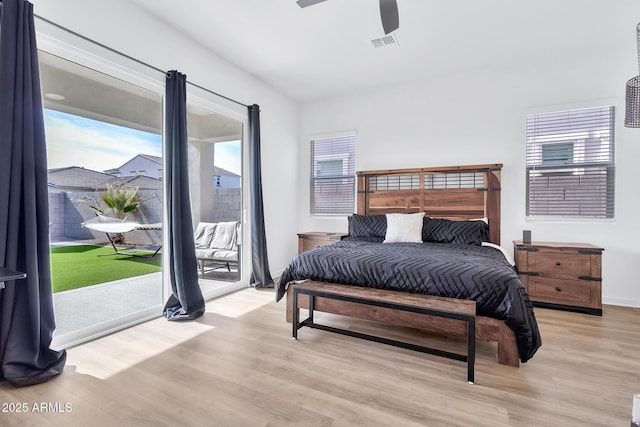 bedroom with access to outside, ceiling fan, and light wood-type flooring