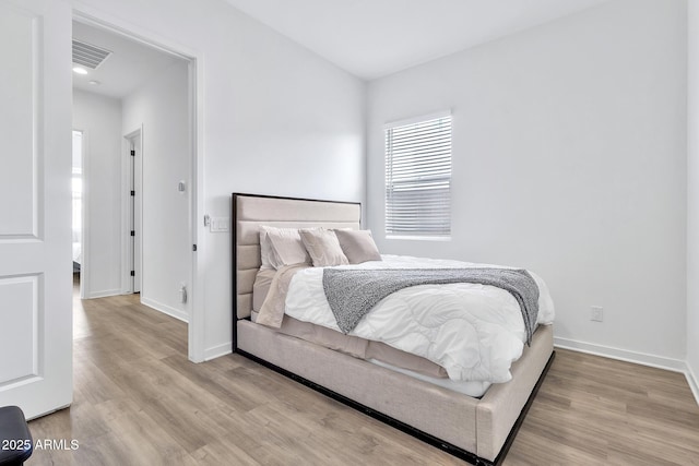 bedroom featuring light hardwood / wood-style floors