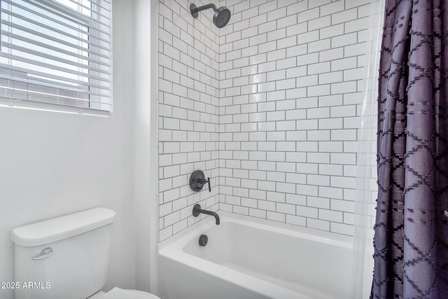 bathroom with toilet and shower / bath combo with shower curtain