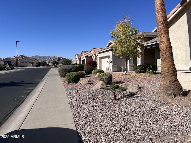 view of side of home featuring a garage